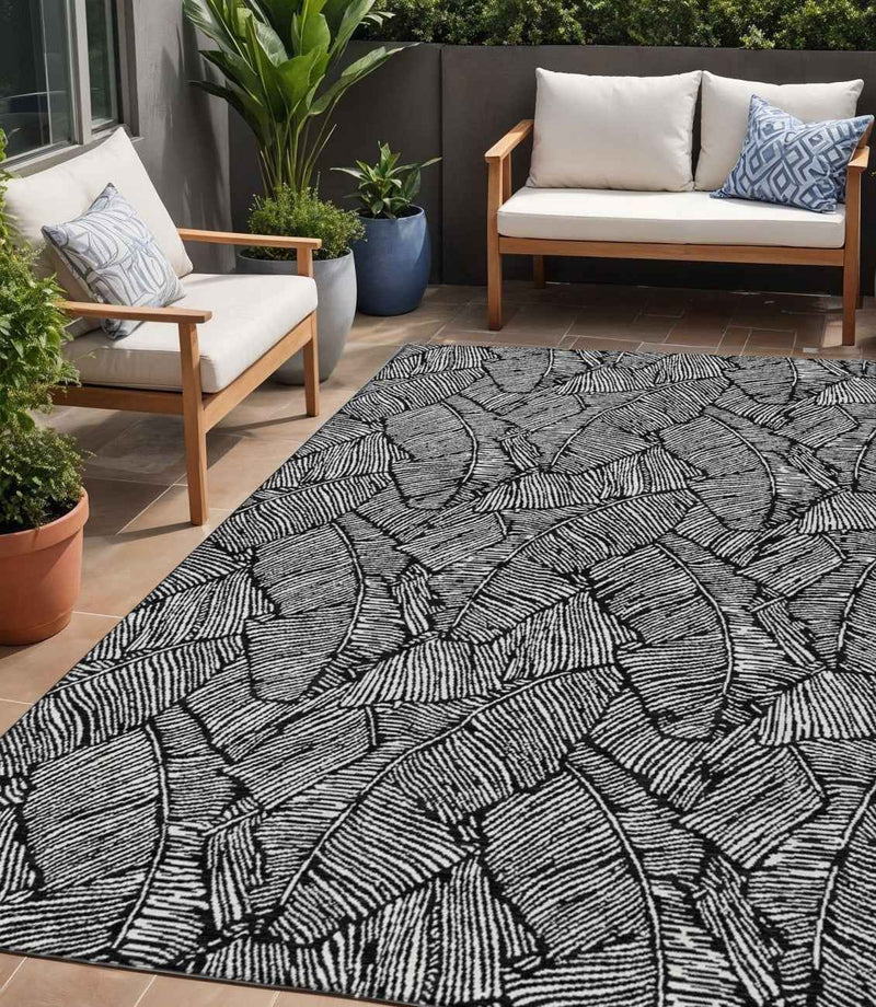 5' X 8' Black And Ivory Floral Washable Indoor Outdoor Area Rug