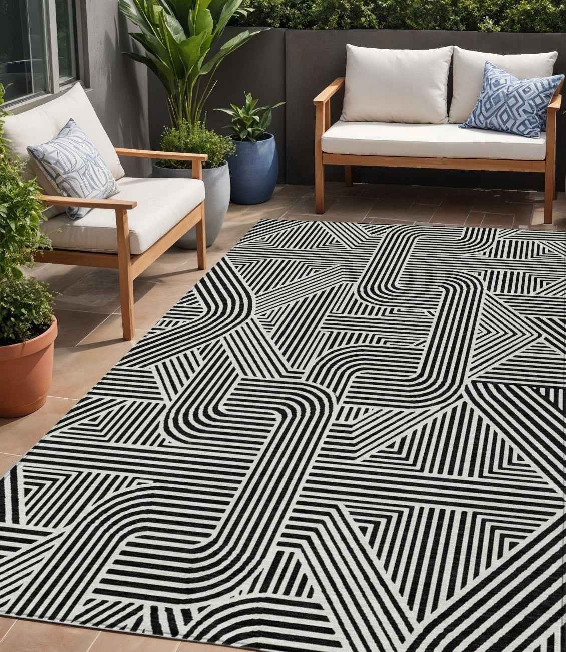 5' X 8' Black And Ivory Abstract Washable Indoor Outdoor Area Rug