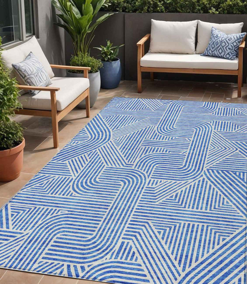 5' X 8' Blue And Ivory Abstract Washable Indoor Outdoor Area Rug
