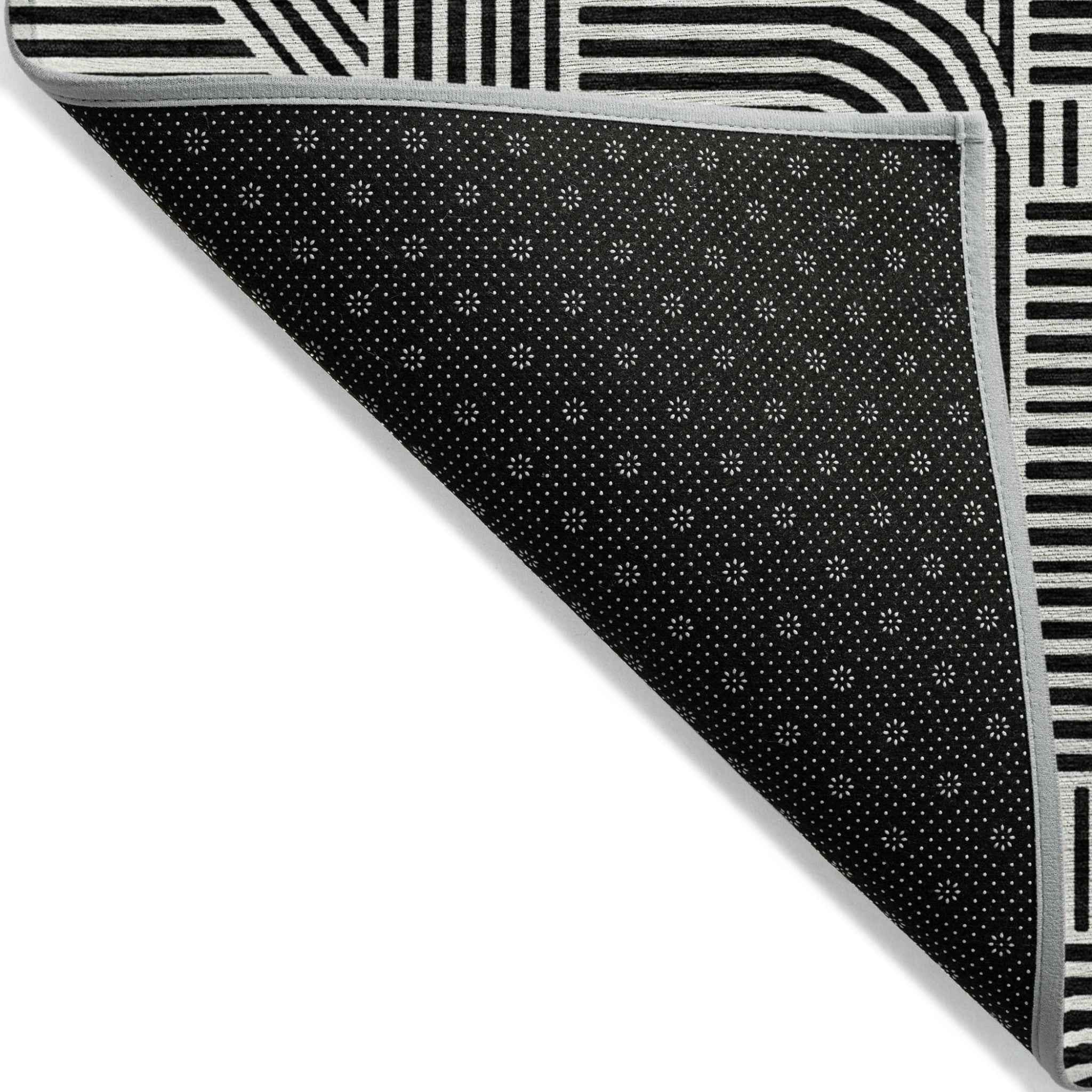 9' X 12' Black And Ivory Abstract Washable Indoor Outdoor Area Rug