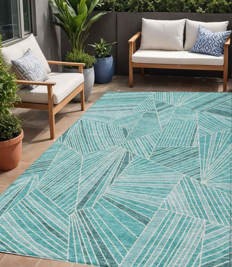5' X 8' Teal Blue And Ivory Geometric Washable Indoor Outdoor Area Rug