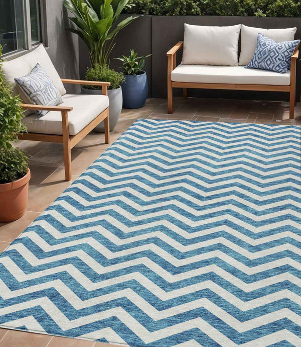 5' X 8' Teal Blue And Ivory Chevron Washable Indoor Outdoor Area Rug