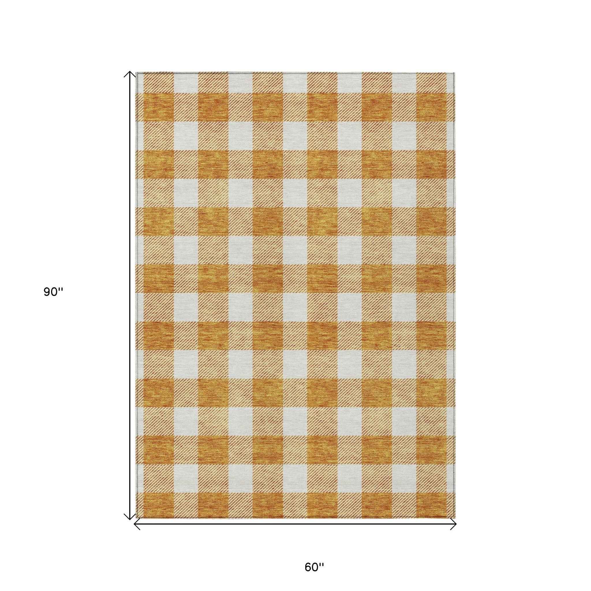 5' X 8' Orange And Beige Plaid Washable Indoor Outdoor Area Rug