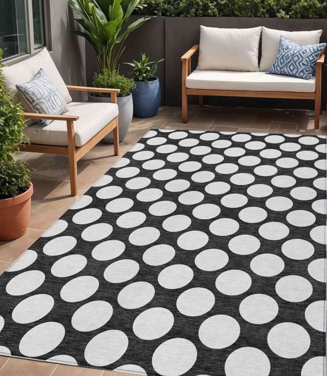 5' X 8' Black And Ivory Polka Dot Washable Indoor Outdoor Area Rug