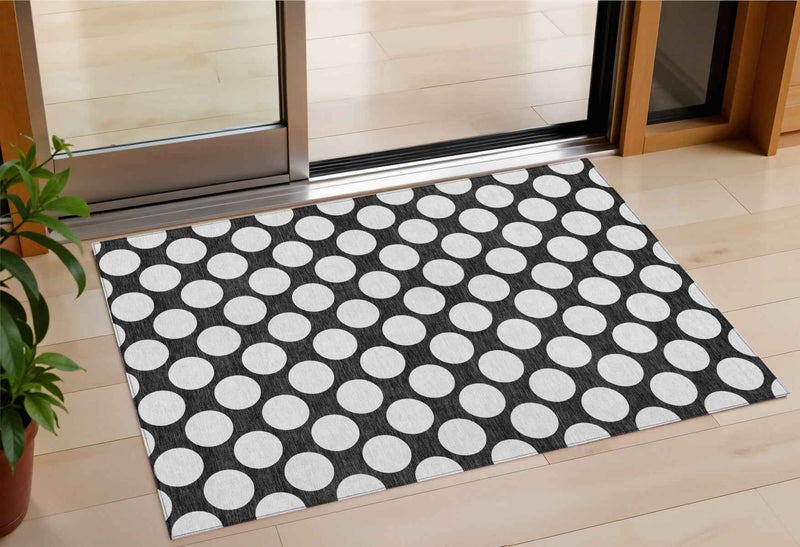 3' X 5' Black And Ivory Polka Dot Washable Indoor Outdoor Area Rug