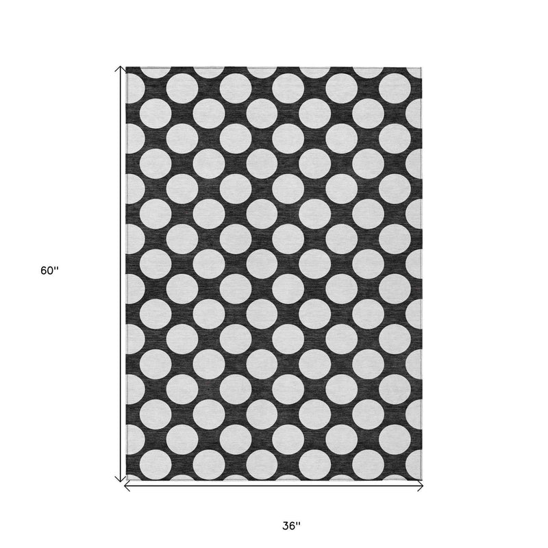 3' X 5' Black And Ivory Polka Dot Washable Indoor Outdoor Area Rug