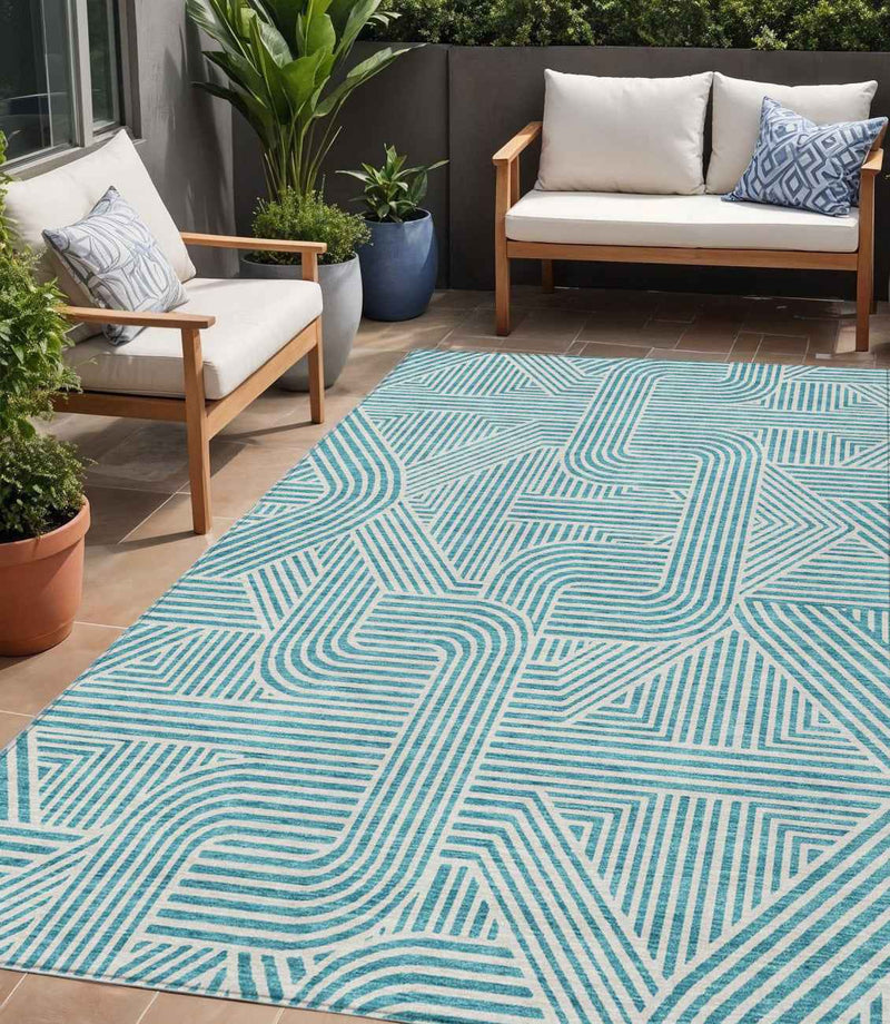 5' X 8' Teal Blue And Ivory Abstract Washable Indoor Outdoor Area Rug