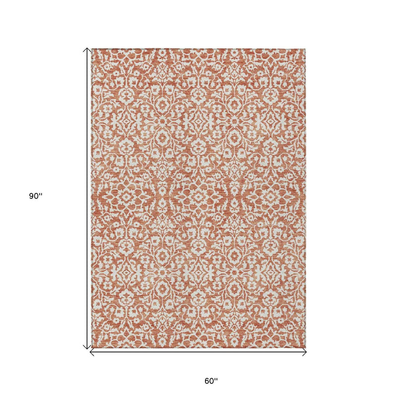 5' X 8' Coral And Ivory Damask Washable Indoor Outdoor Area Rug