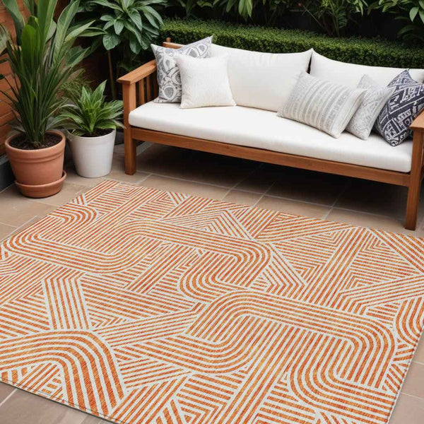 10' X 14' Orange And Ivory Abstract Washable Indoor Outdoor Area Rug