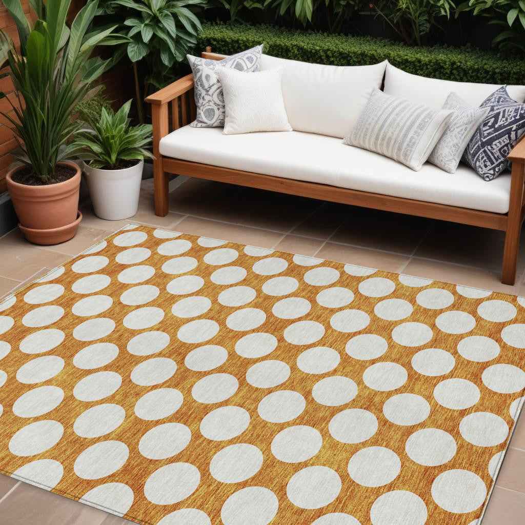10' X 14' Orange And Ivory Polka Dot Washable Indoor Outdoor Area Rug