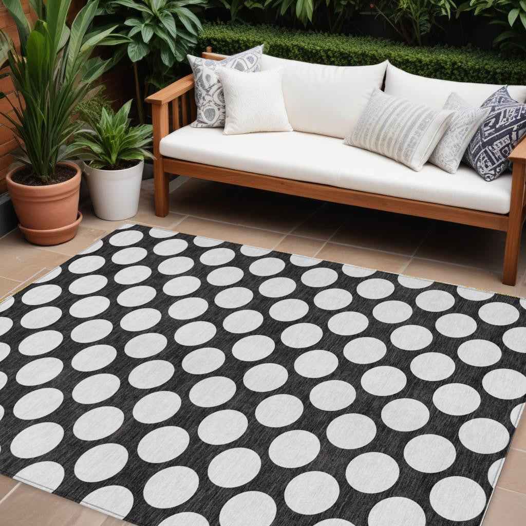 10' X 14' Black And Ivory Polka Dot Washable Indoor Outdoor Area Rug