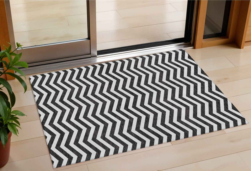 3' X 5' Black And Ivory Chevron Washable Indoor Outdoor Area Rug