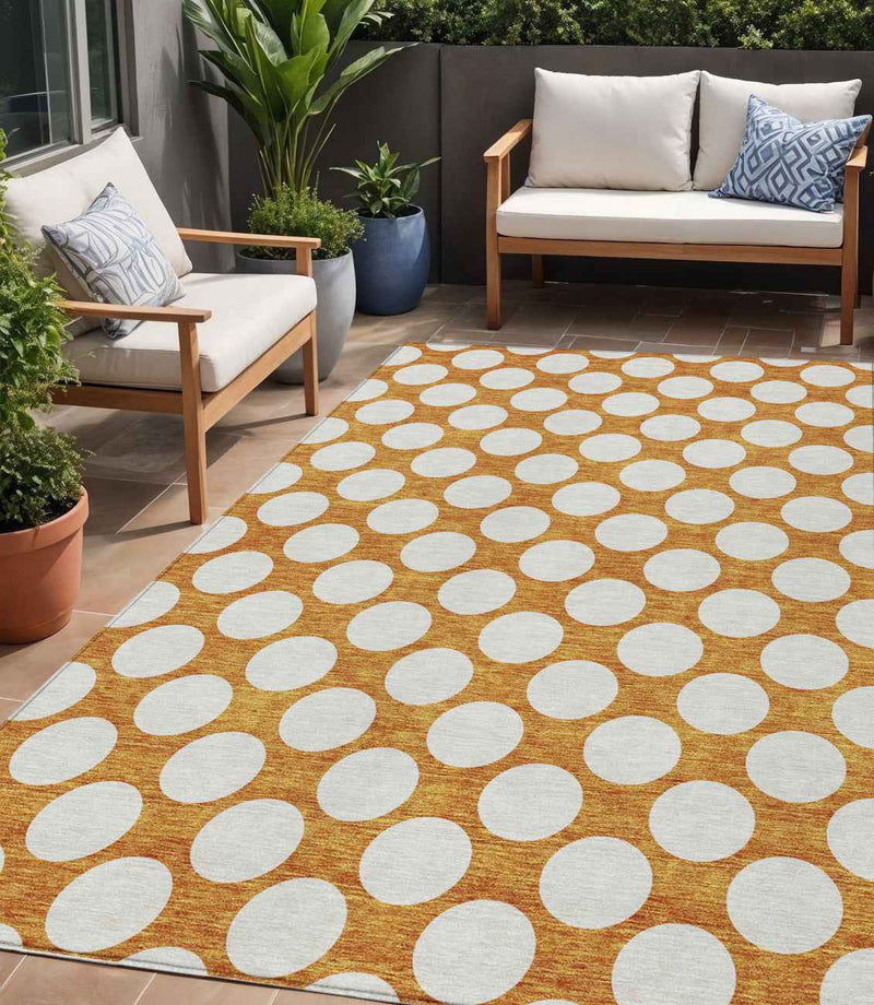 5' X 8' Orange And Ivory Polka Dot Washable Indoor Outdoor Area Rug