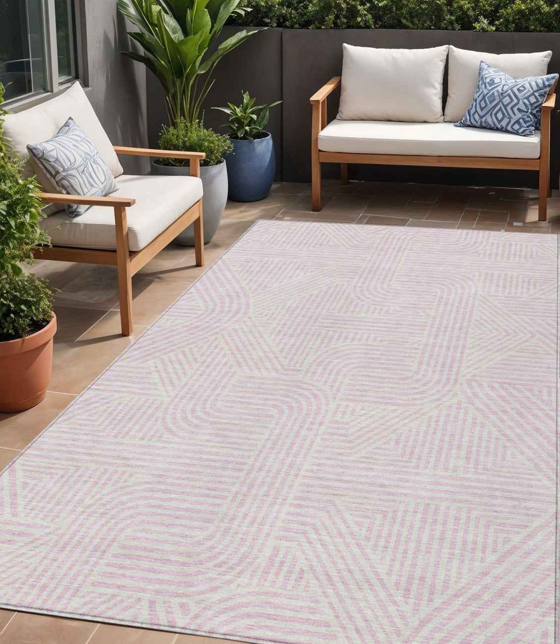 5' X 8' Pink And Ivory Abstract Washable Indoor Outdoor Area Rug