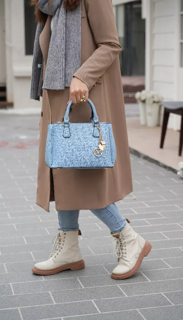 Light blue vegan leather satchel bag with two top handles, chain charm, and matching wallet