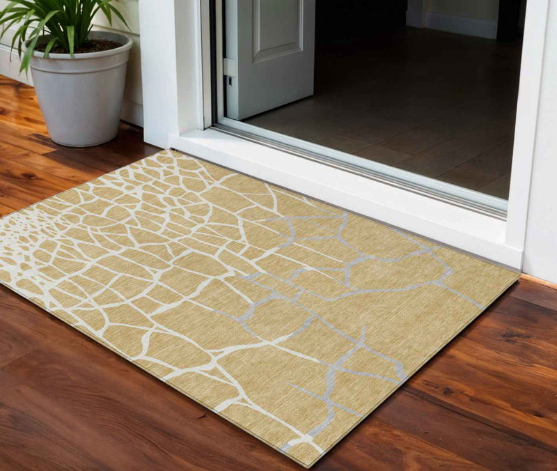 3' X 5' Gold And Beige Abstract Washable Indoor Outdoor Area Rug