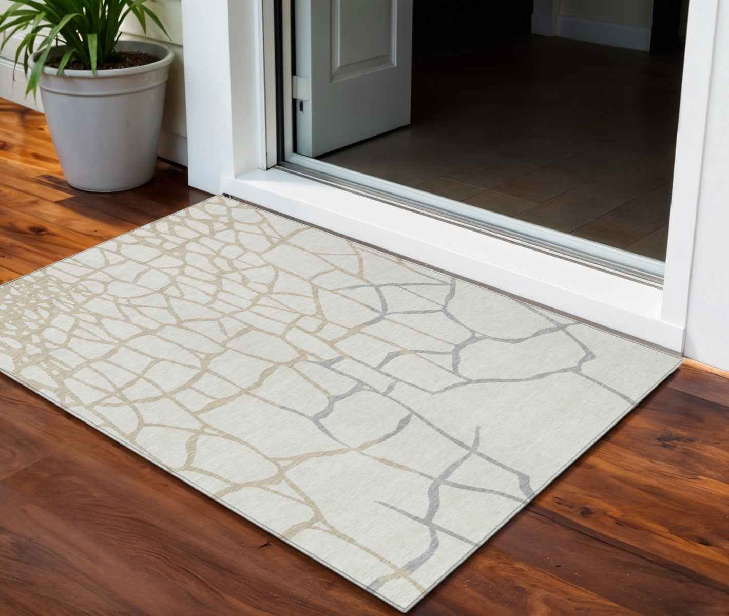3' X 5' Ivory And Beige Abstract Washable Indoor Outdoor Area Rug