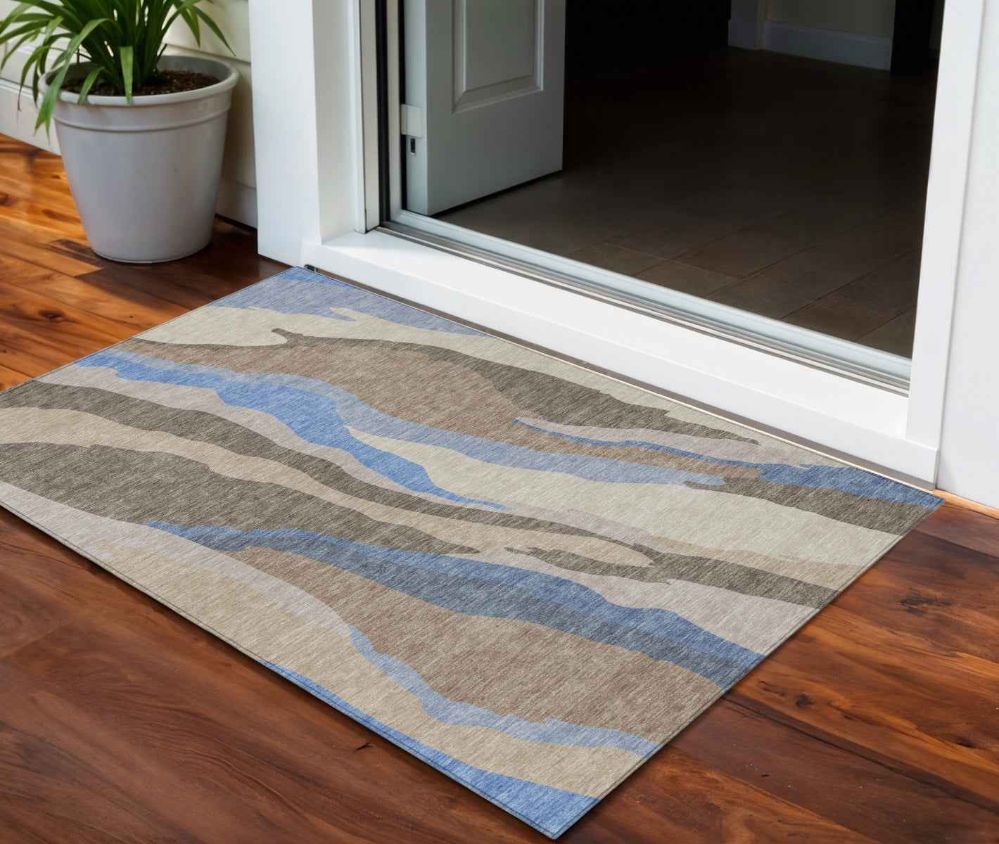 3' X 5' Taupe Tan And Blue Abstract Washable Indoor Outdoor Area Rug