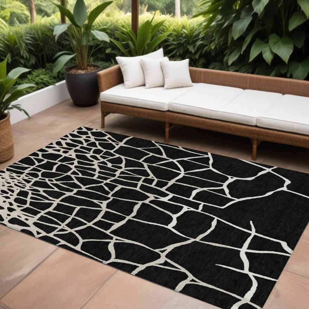 8' X 10' Black And Beige Abstract Washable Indoor Outdoor Area Rug