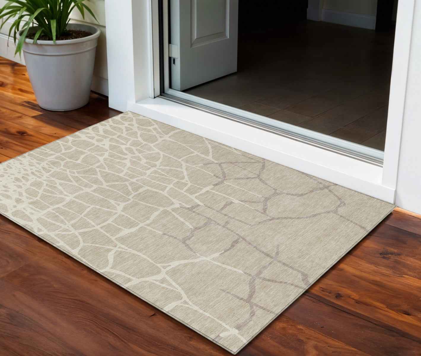 3' X 5' Beige And Tan Abstract Washable Indoor Outdoor Area Rug