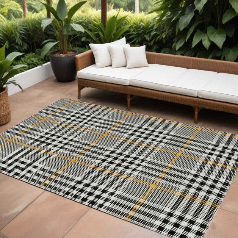 9' X 12' Black Gold And Ivory Plaid Washable Indoor Outdoor Area Rug