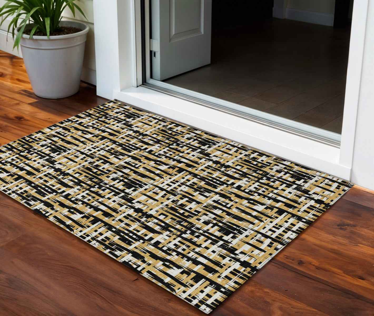 3' X 5' Black Gold And Ivory Abstract Washable Indoor Outdoor Area Rug