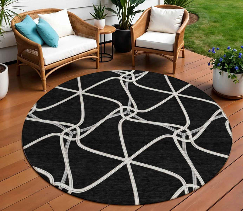 8' Black And Ivory Round Geometric Washable Indoor Outdoor Area Rug