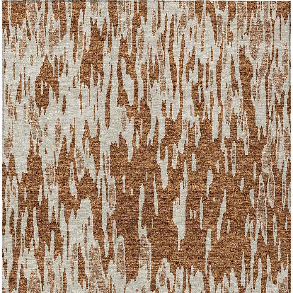 9' X 12' Orange And Ivory Abstract Washable Indoor Outdoor Area Rug