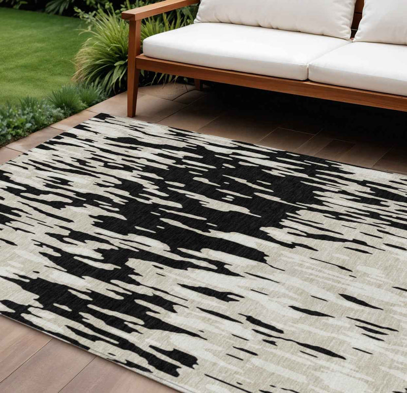10' X 14' Black And Ivory Abstract Washable Indoor Outdoor Area Rug