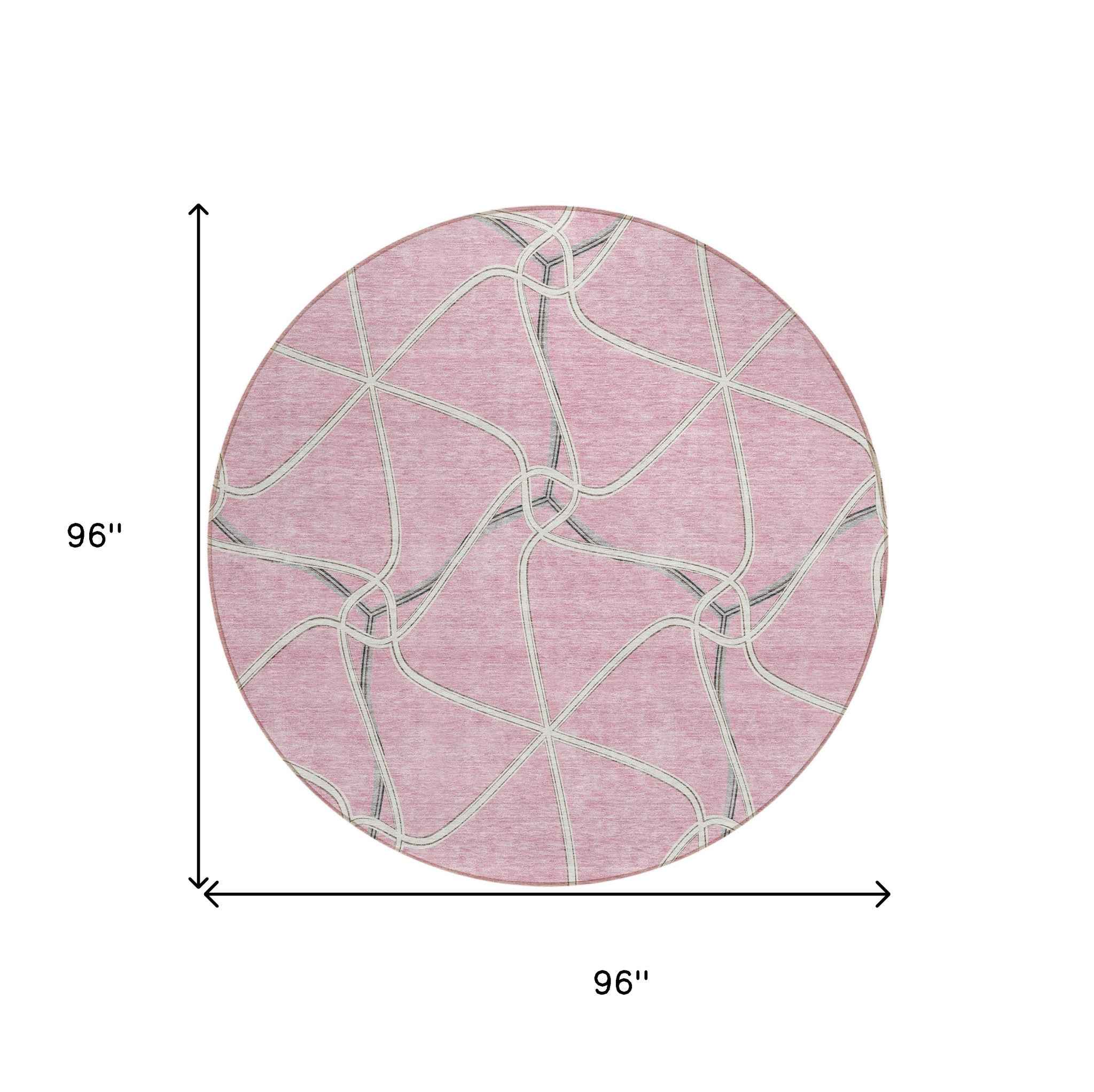 8' Pink And Ivory Round Geometric Washable Indoor Outdoor Area Rug