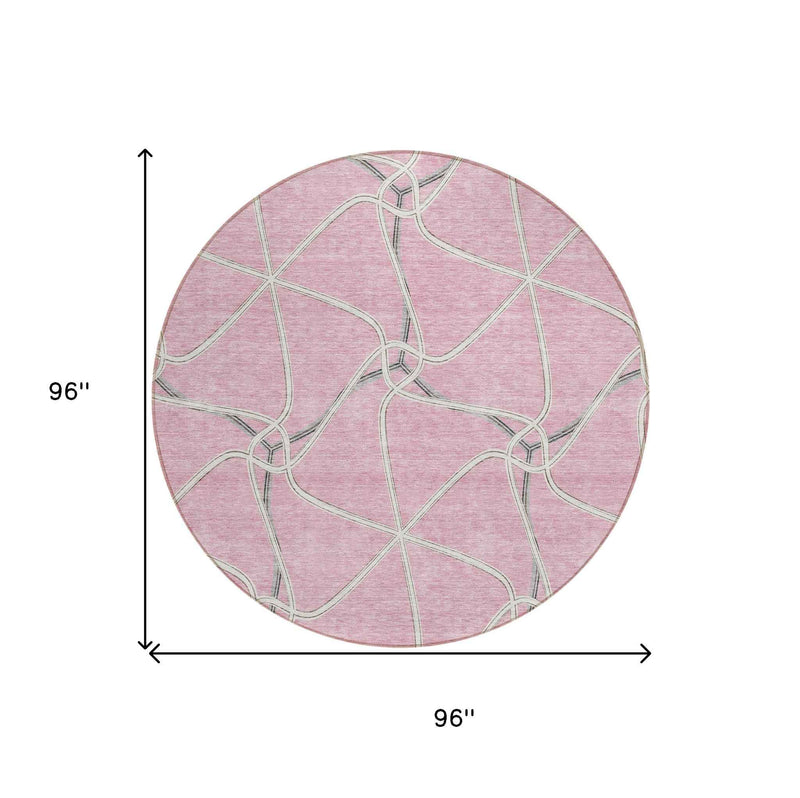8' Pink And Ivory Round Geometric Washable Indoor Outdoor Area Rug