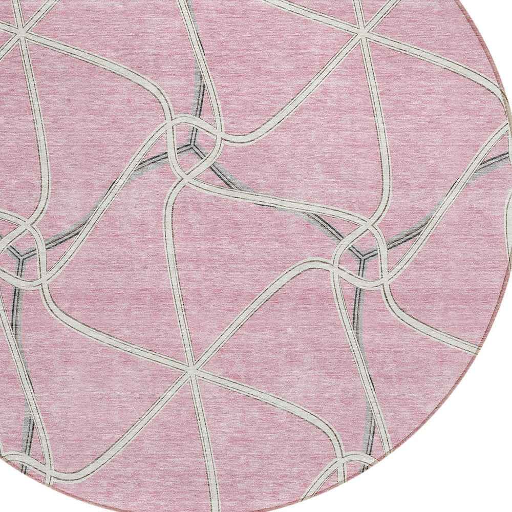 8' Pink And Ivory Round Geometric Washable Indoor Outdoor Area Rug