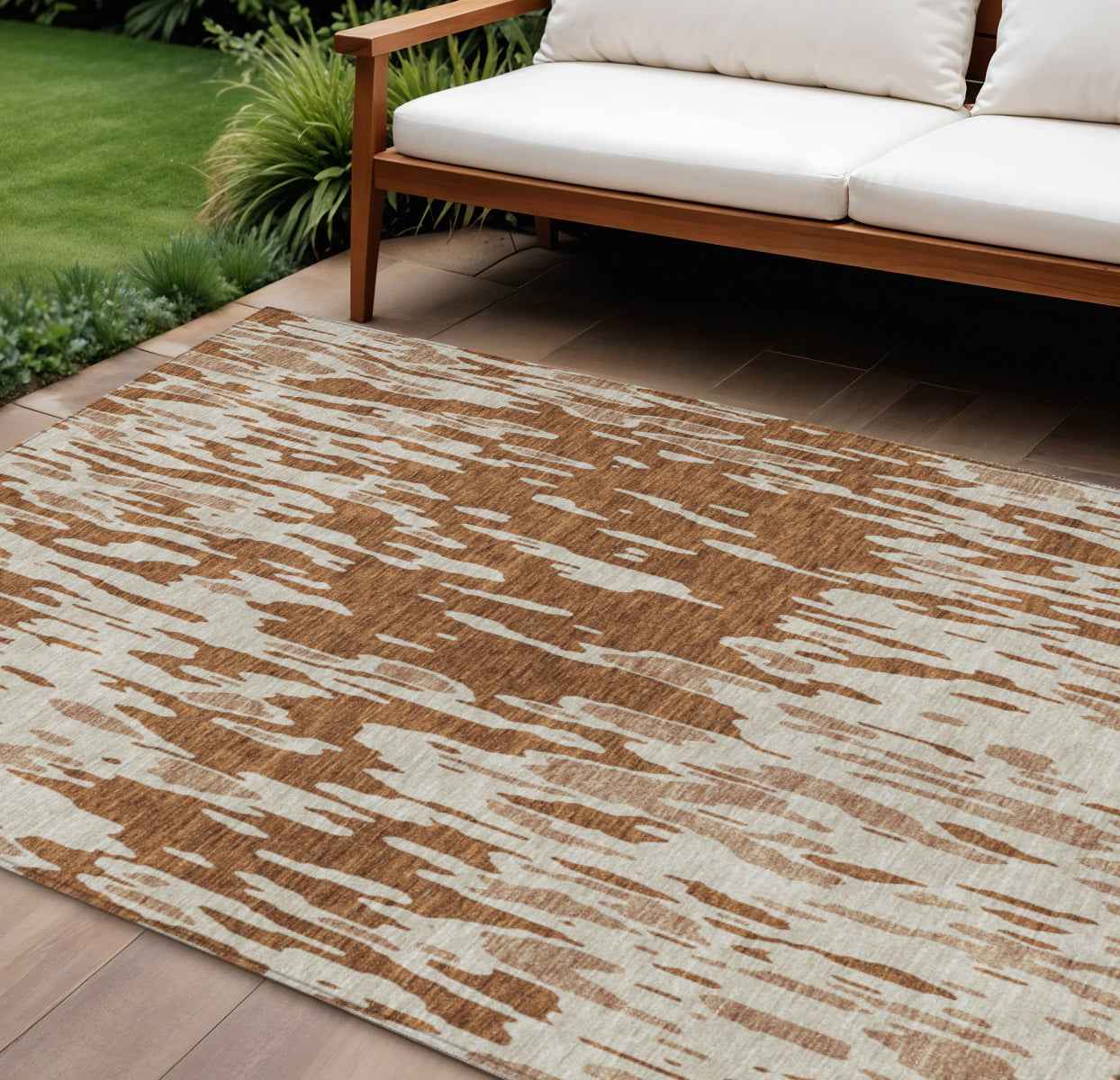 10' X 14' Orange And Ivory Abstract Washable Indoor Outdoor Area Rug