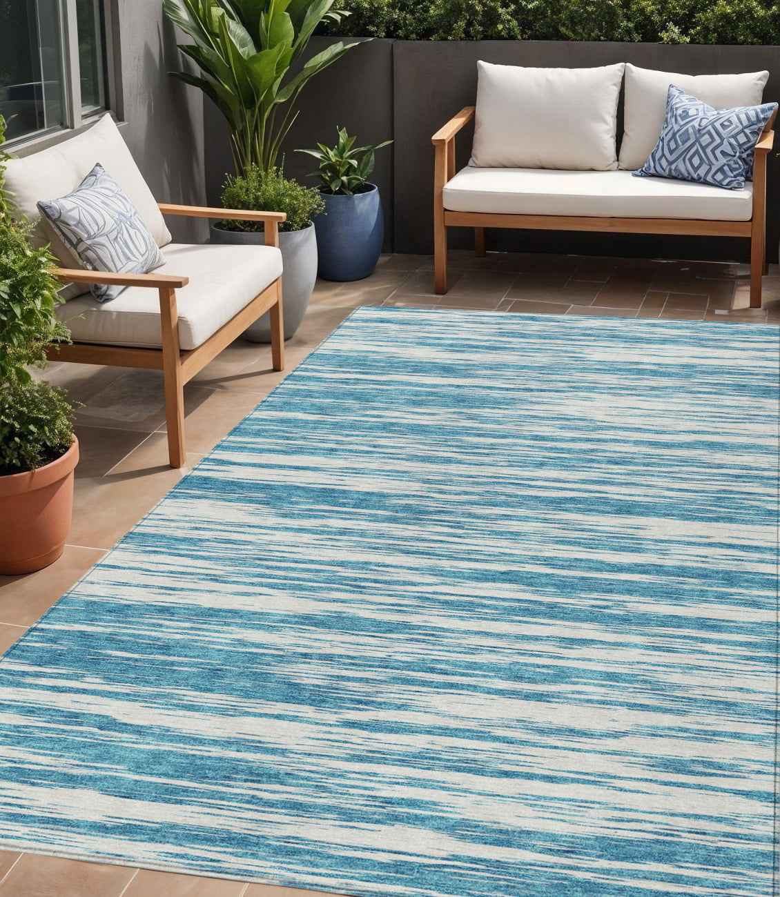5' X 8' Teal Blue And Ivory Abstract Washable Indoor Outdoor Area Rug