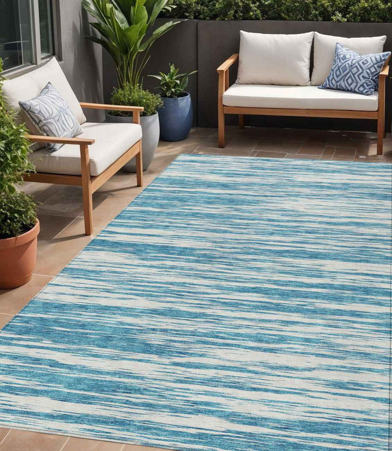5' X 8' Teal Blue And Ivory Abstract Washable Indoor Outdoor Area Rug