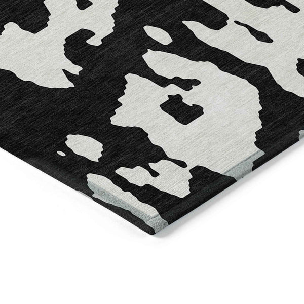 5' X 8' Black And Ivory Abstract Washable Indoor Outdoor Area Rug