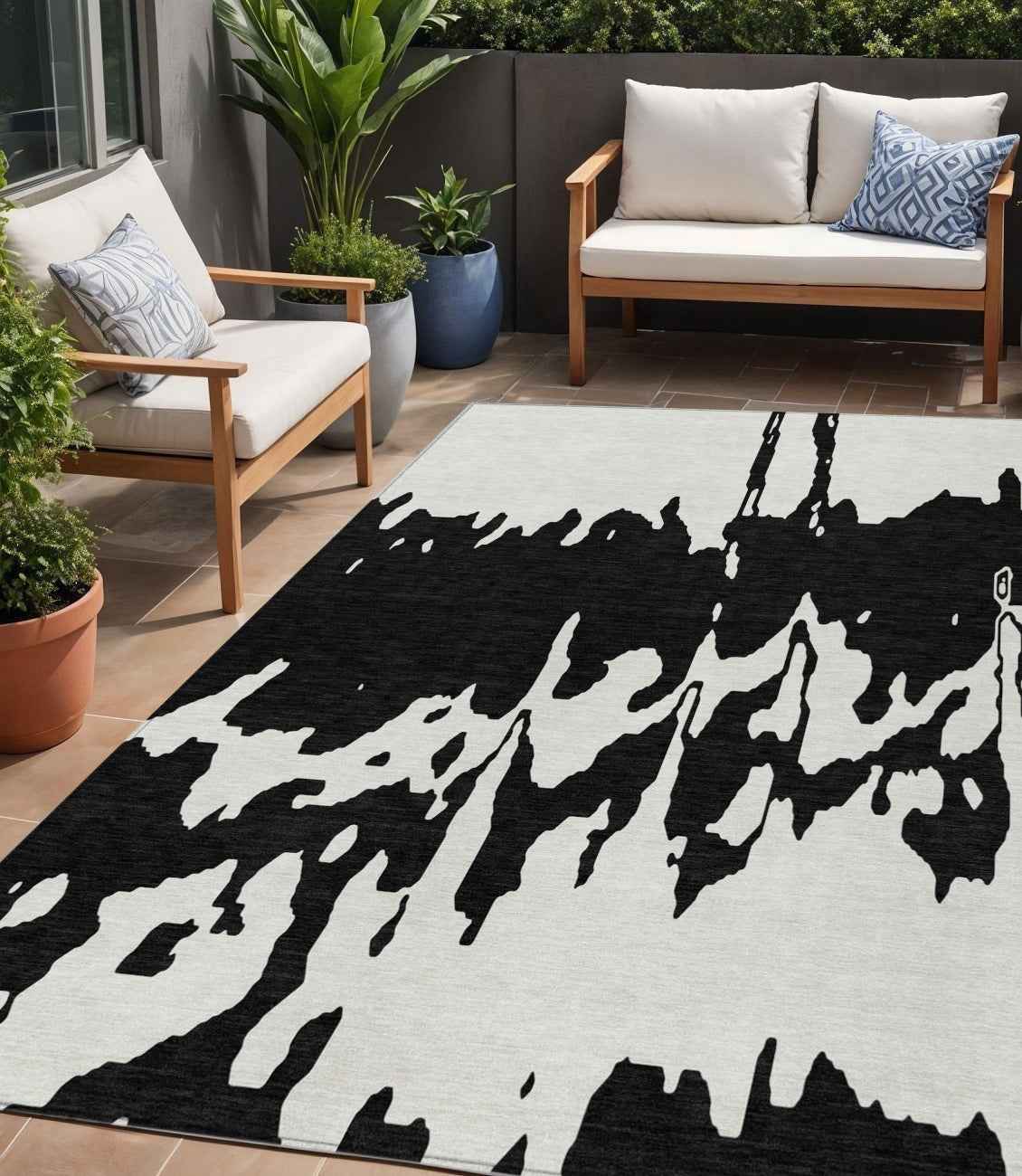 5' X 8' Black And Ivory Abstract Washable Indoor Outdoor Area Rug