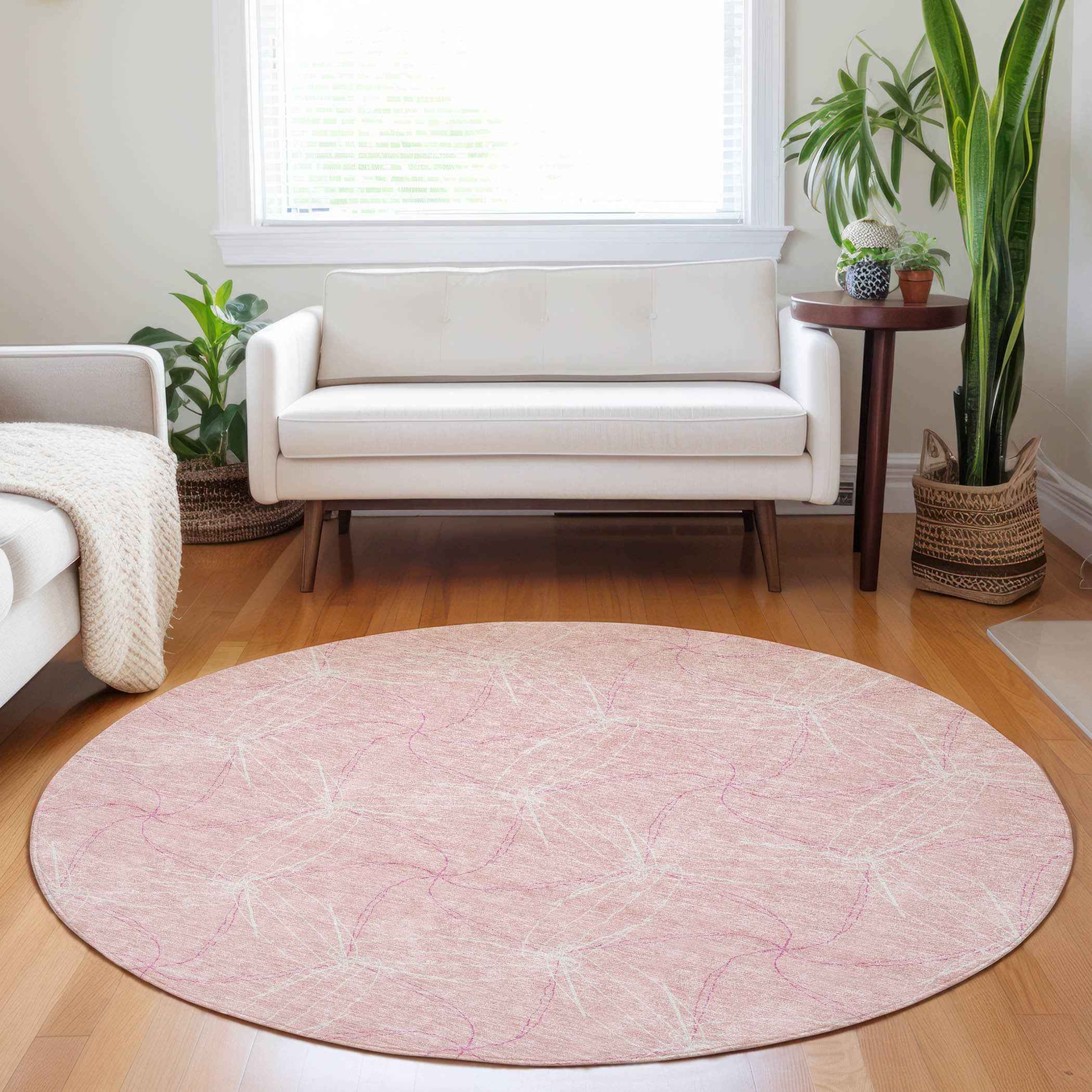 8' Pink And Ivory Round Geometric Washable Indoor Outdoor Area Rug