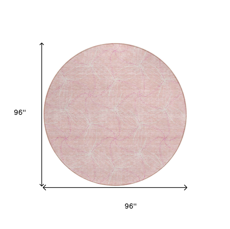 8' Pink And Ivory Round Geometric Washable Indoor Outdoor Area Rug