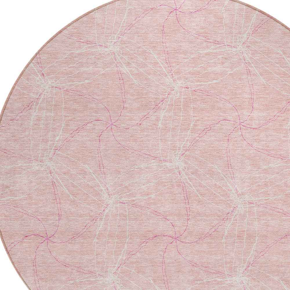 8' Pink And Ivory Round Geometric Washable Indoor Outdoor Area Rug