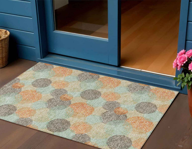3' X 5' Beige Aqua And Orange Polka Dot Washable Indoor Outdoor Area Rug