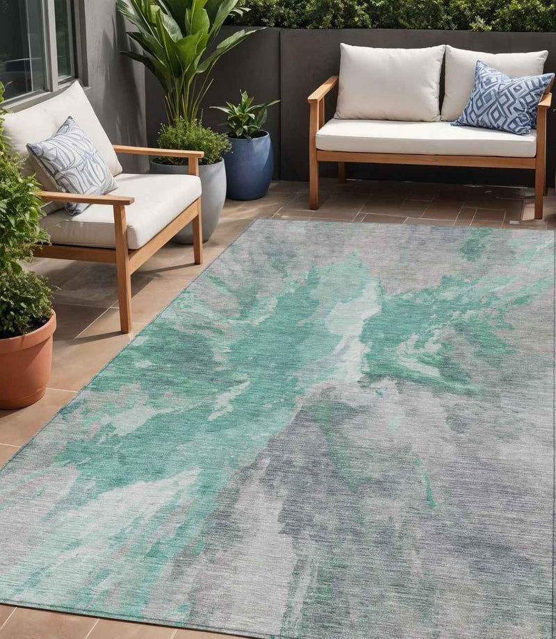 5' X 8' Teal Blue And Lavender Abstract Washable Indoor Outdoor Area Rug