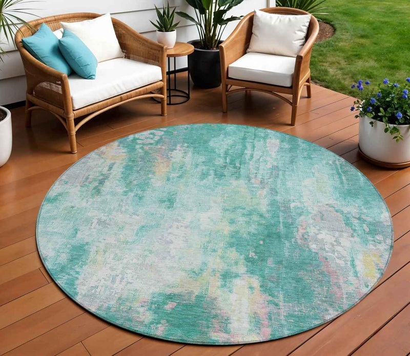 8' Teal Blue Peach And Ivory Round Abstract Washable Indoor Outdoor Area Rug