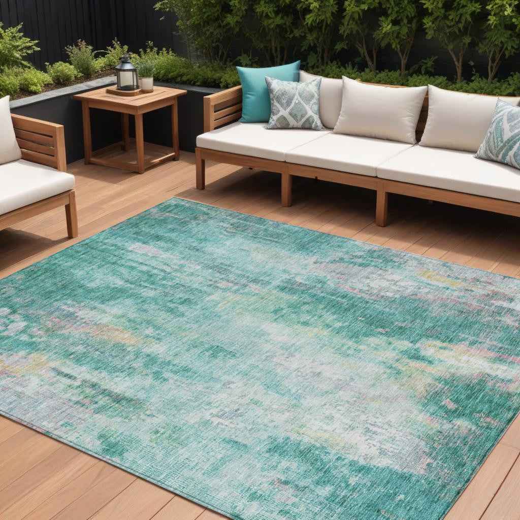 5' X 8' Teal Blue Peach And Ivory Abstract Washable Indoor Outdoor Area Rug