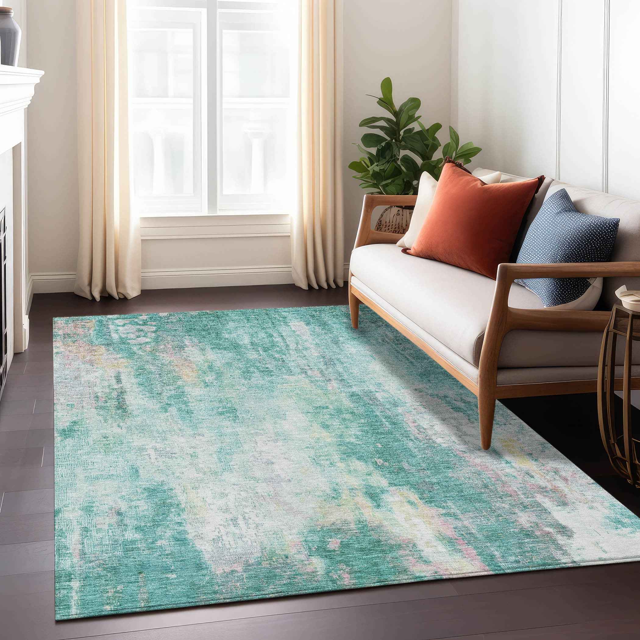 10' X 14' Teal Blue Peach And Ivory Abstract Washable Indoor Outdoor Area Rug