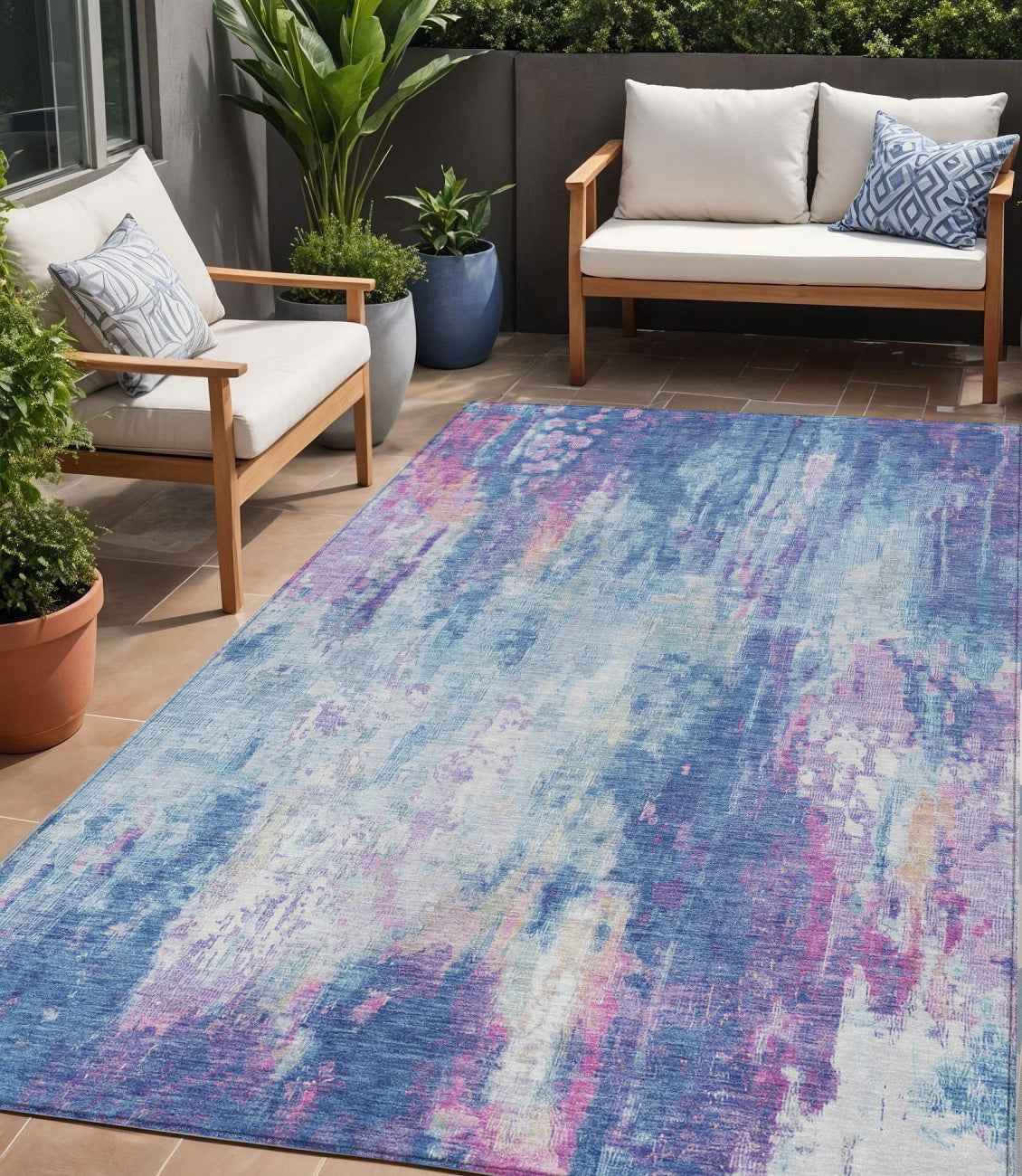5' X 8' Blue Peach And Sky Blue Abstract Washable Indoor Outdoor Area Rug