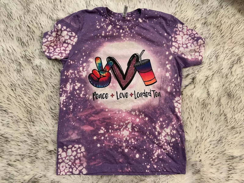 Purple bleached crewneck T-shirt with Peace + Love + Loaded Tea front graphic