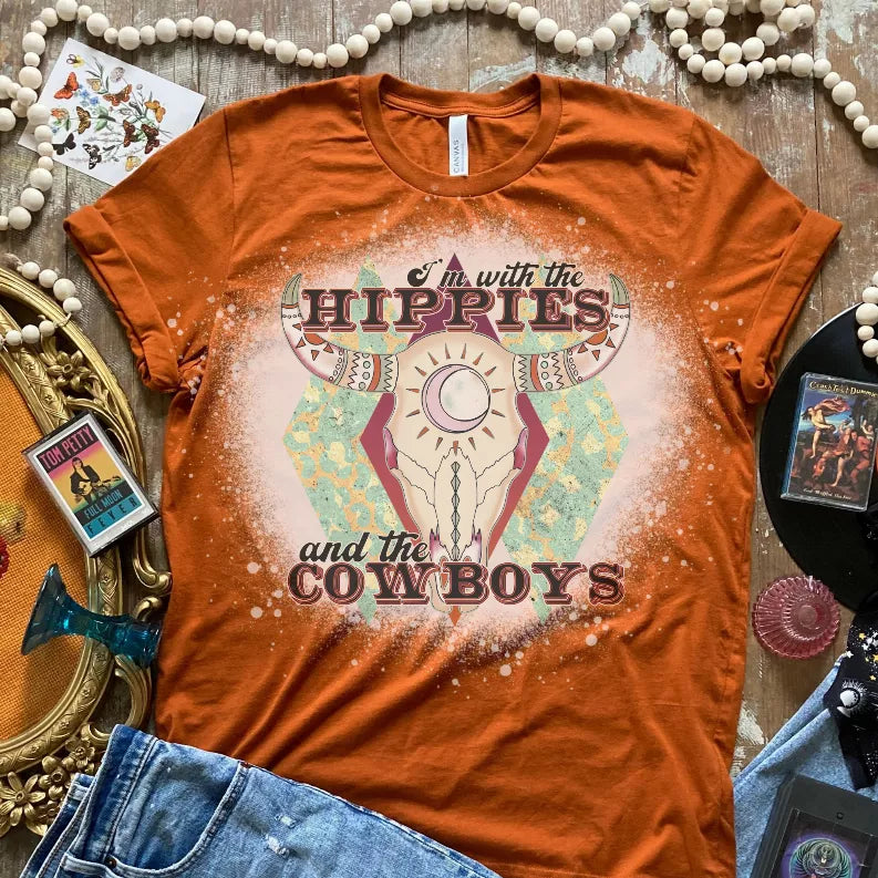 Orange bleached-look T-shirt with hippies and cowboys graphic on front