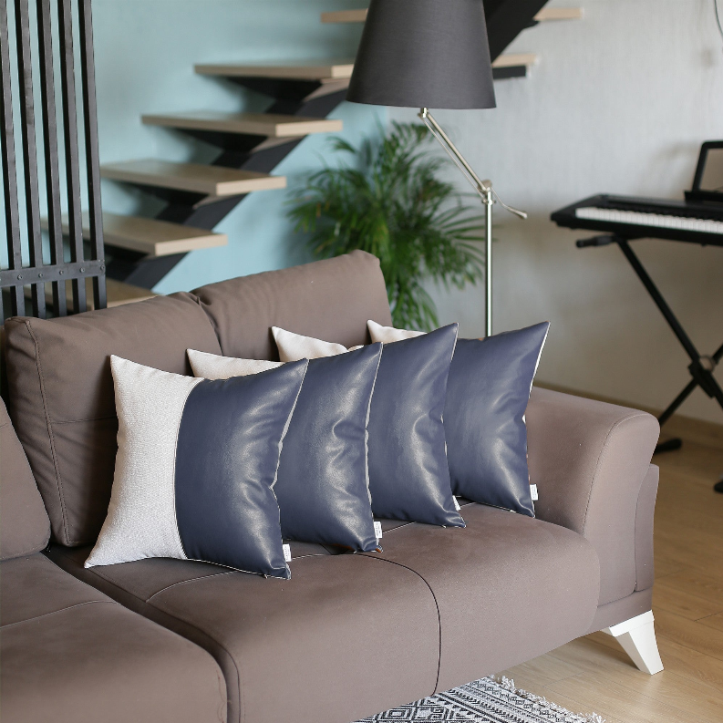 Set of 4 throw pillows, cream and dark blue vertical panel design on couch