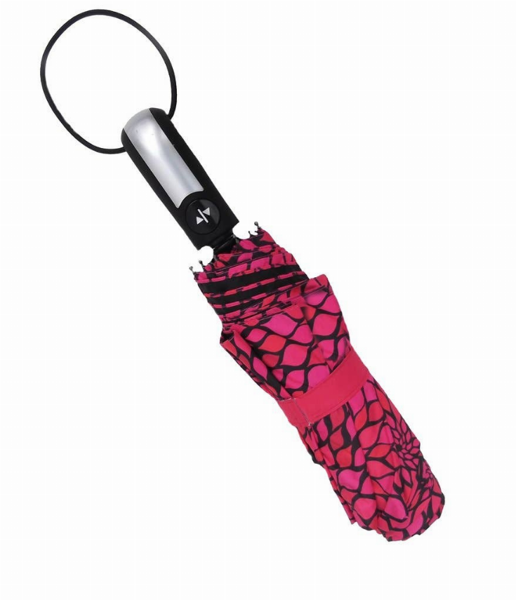 Compact umbrella, closed dark pink fabric with black pattern and black loop handle.